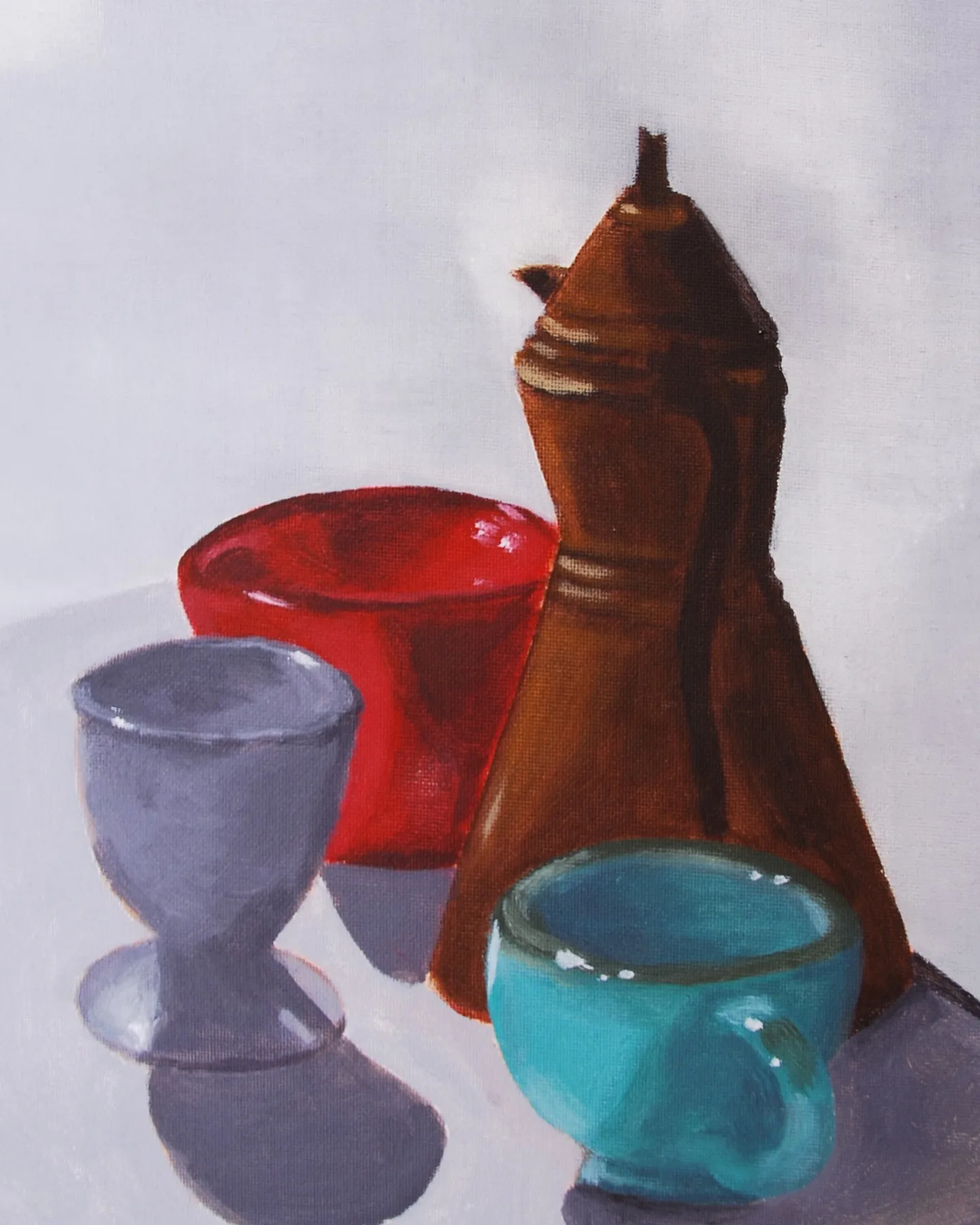 Coffee Pot. A brass coffee pot, a red bowl, an egg cup, and a turquoise mug on a white table. Acrylic on canvas board, painted from life — I painted it for the shadows.